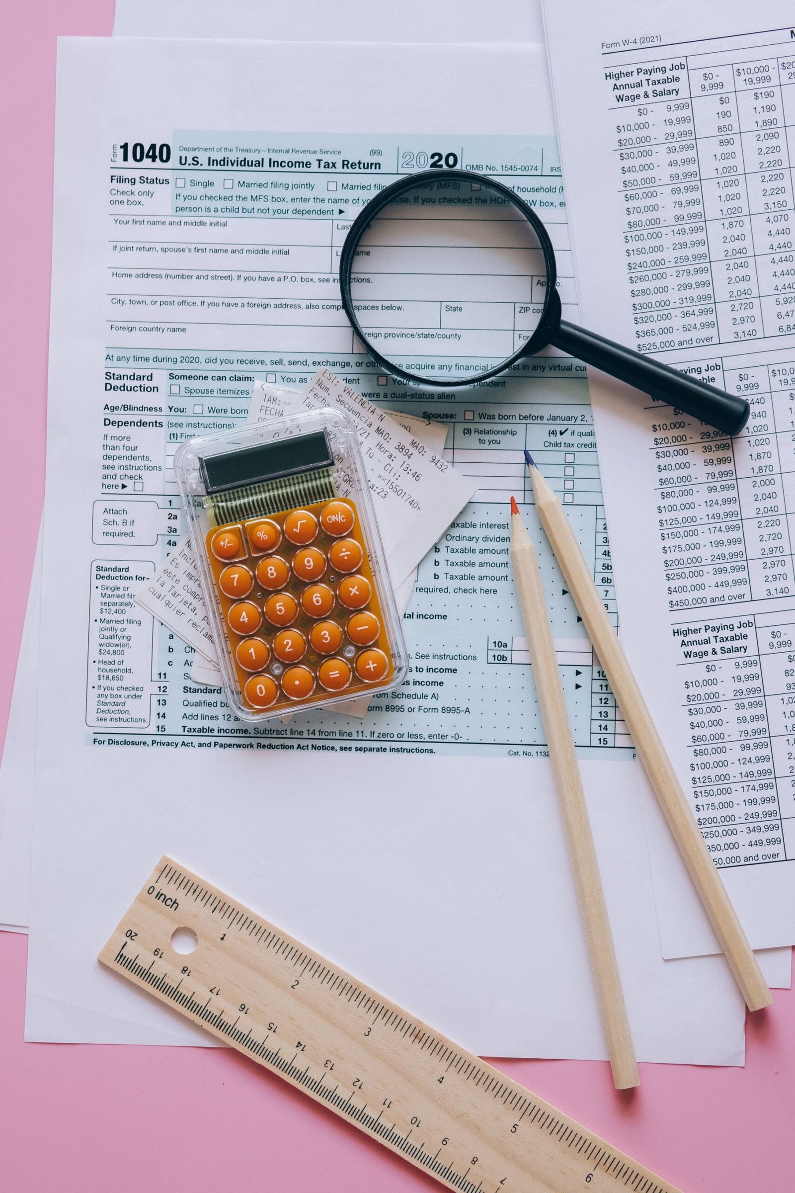 Tax documents with a calculator