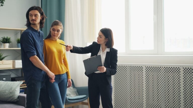 Real estate agent showing a house to a couple
