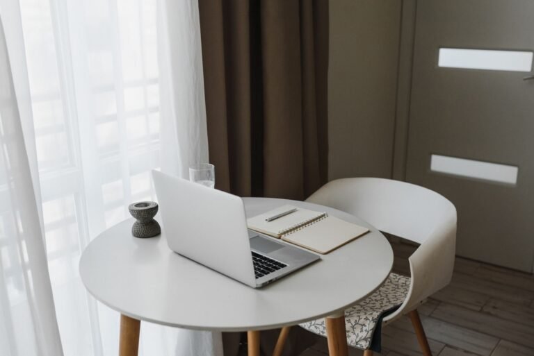 Laptop and notebook on a desk