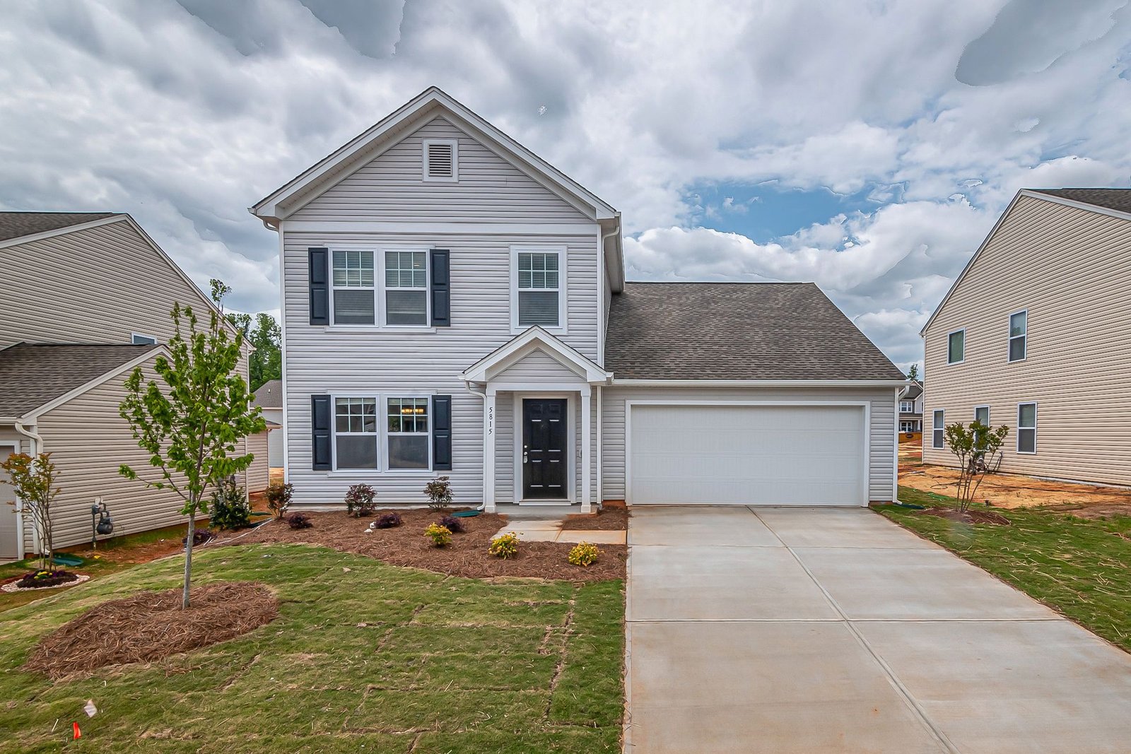 New suburban house exterior with lawn