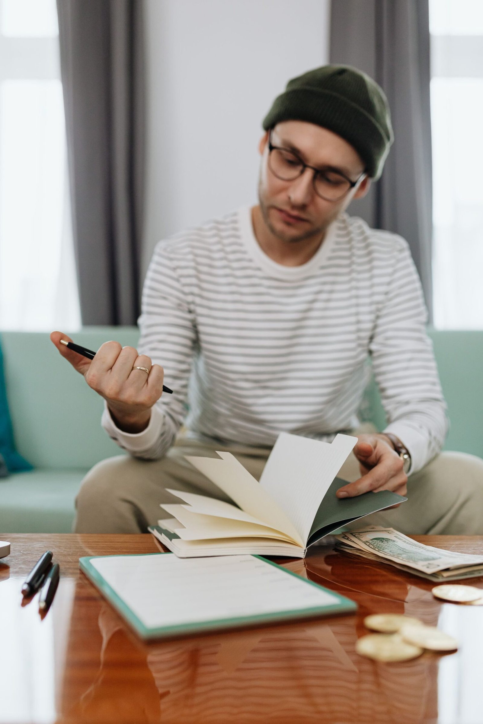 Man writing a budget on paper