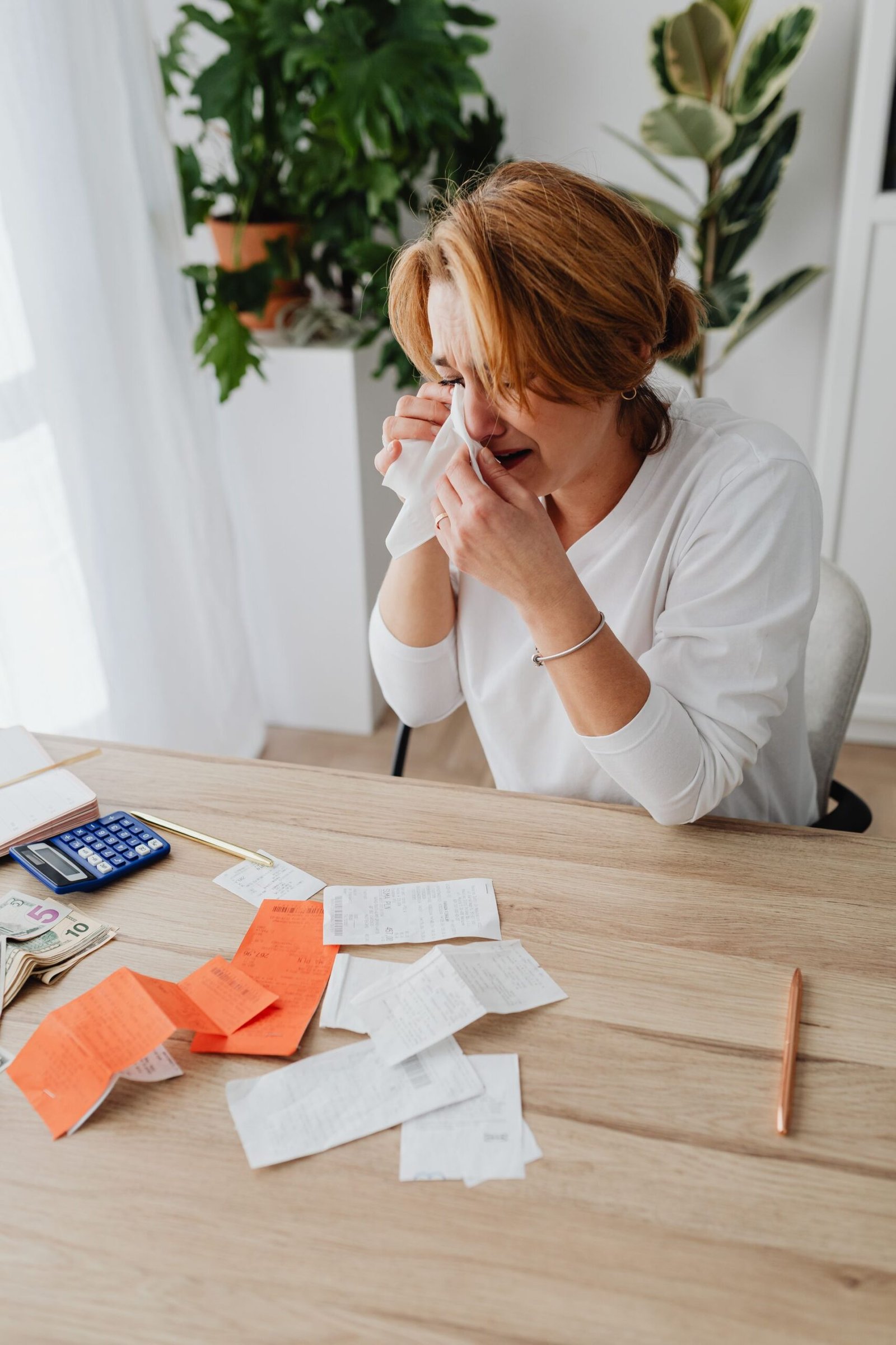 Person facing financial struggle with bills