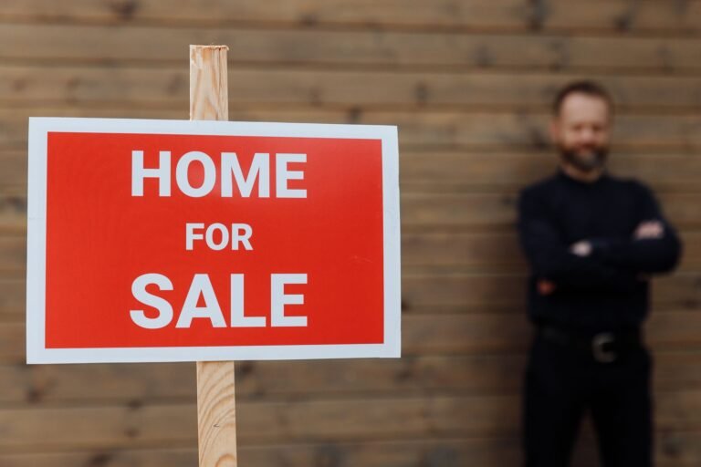 House for sale sign in front of a home