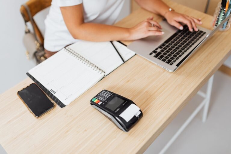 Business owner reviewing loan documents on a laptop