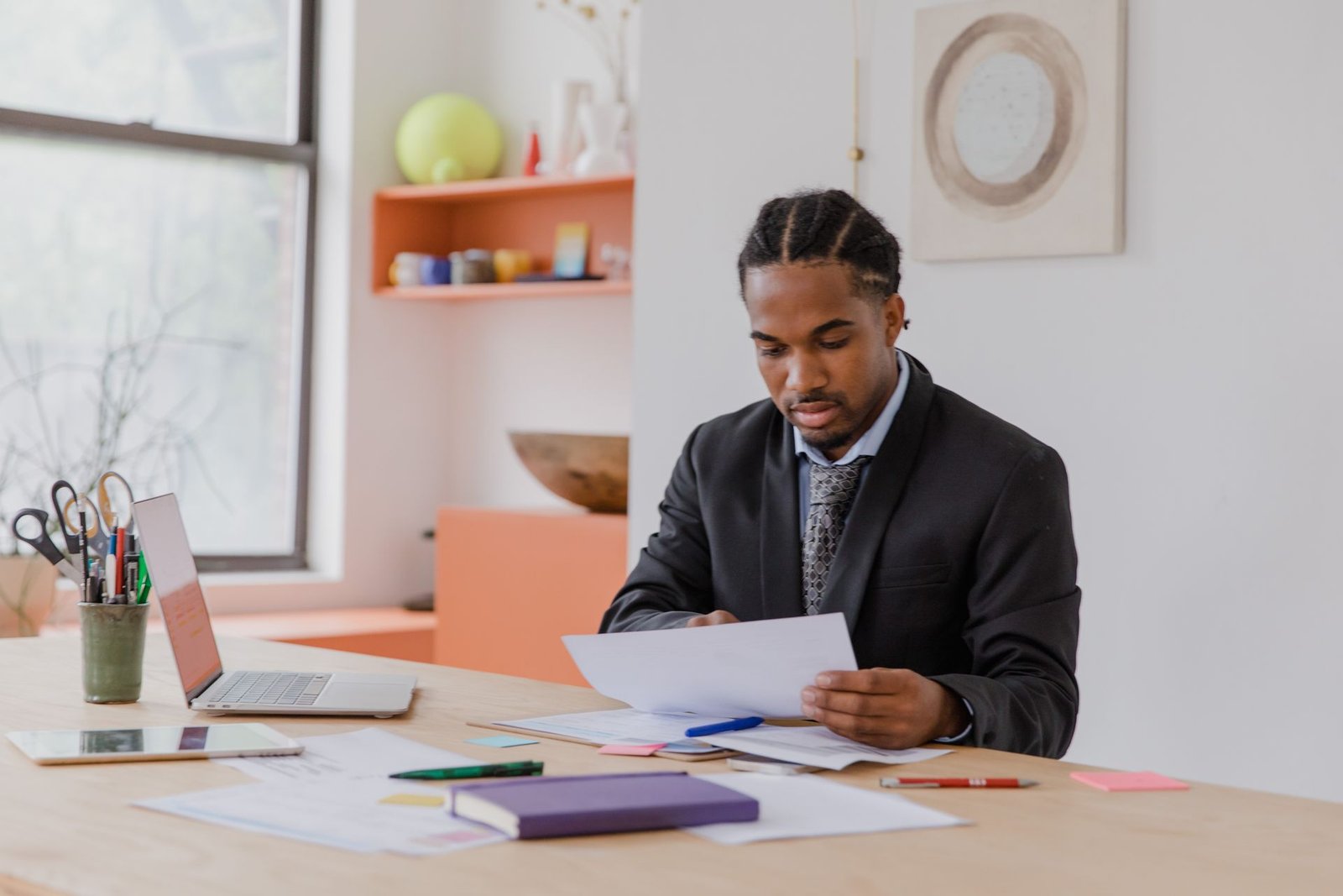 Entrepreneur reviewing financial paperwork with advisor
