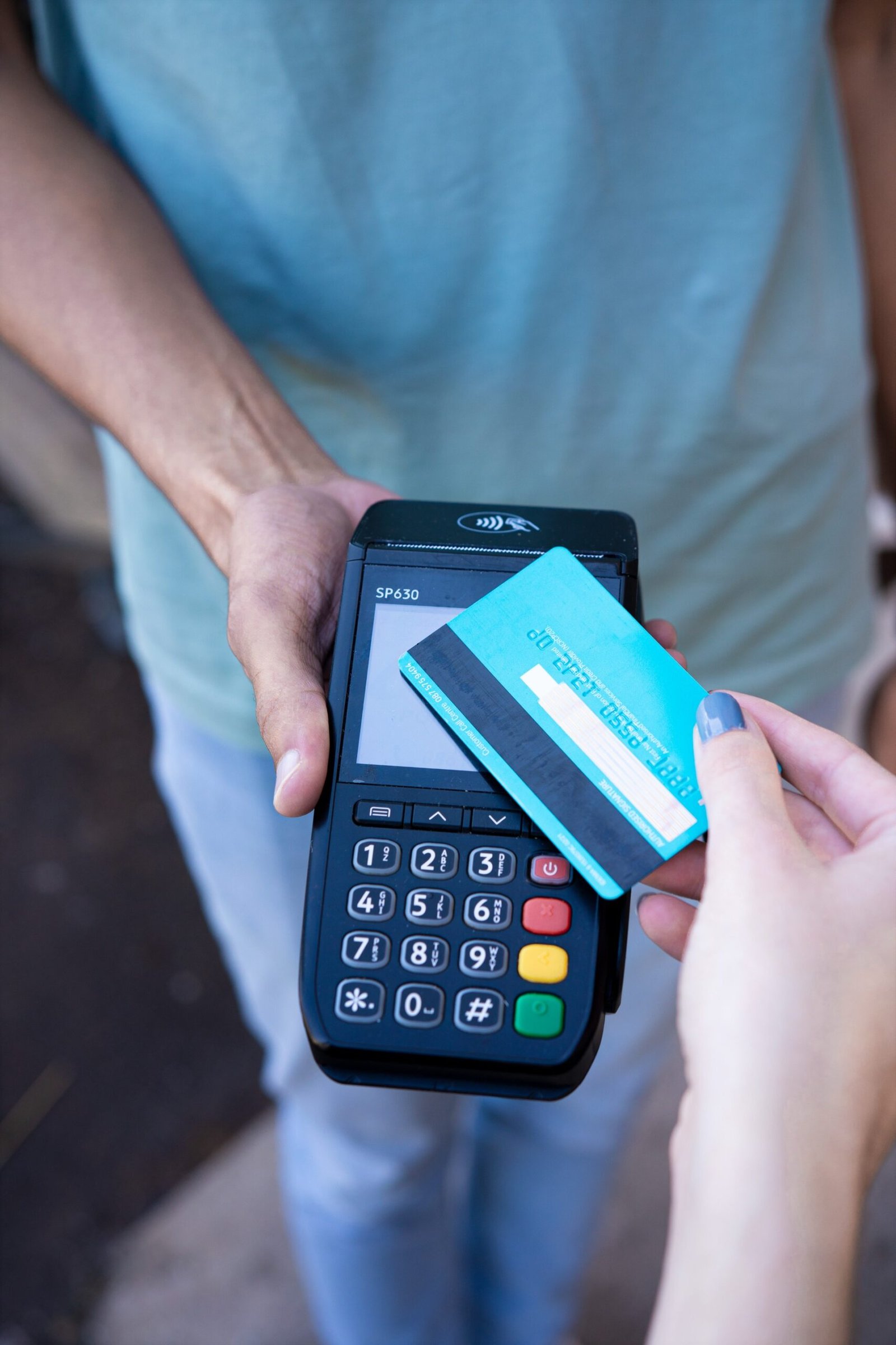 Customer paying with a credit card at a small business