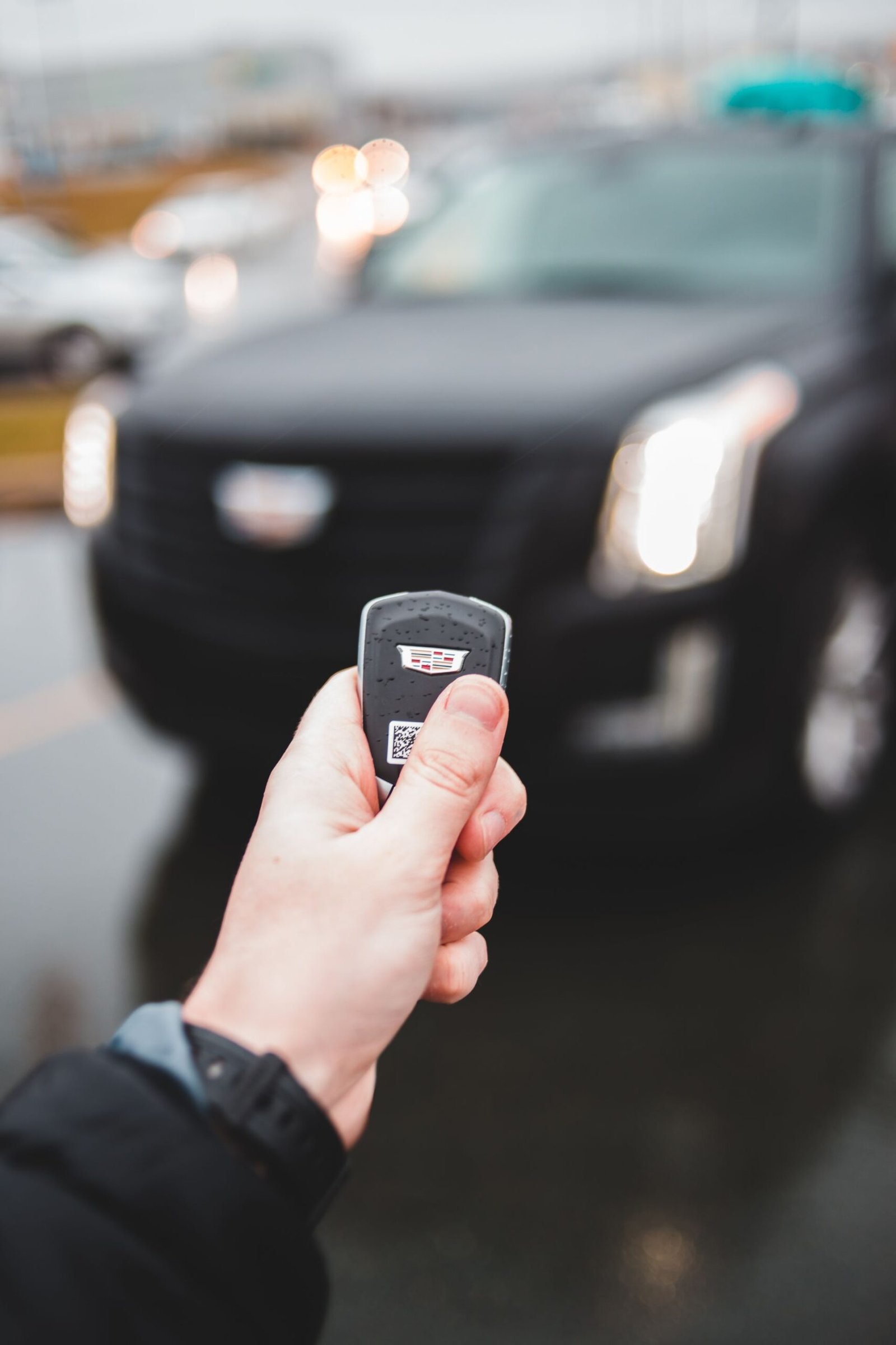 A hand holding a car key