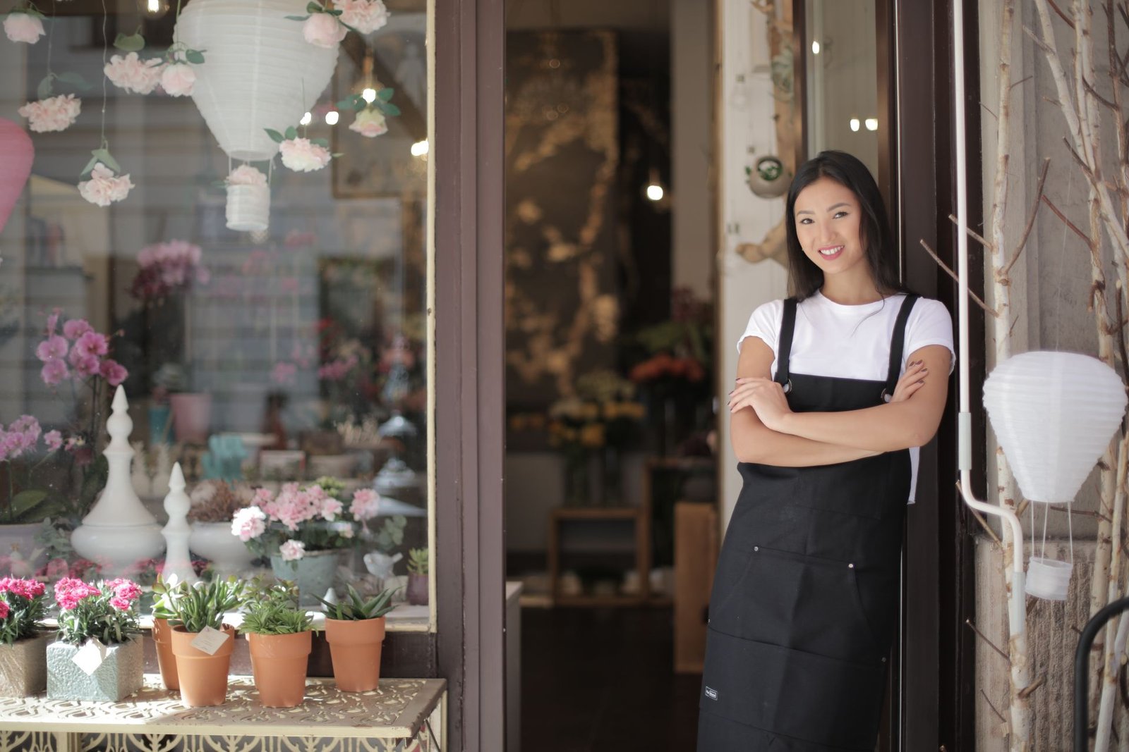 A small business owner at their storefront